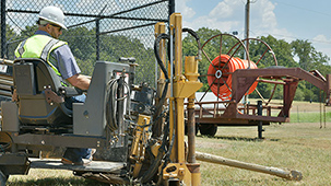 Student operating a horizontal directional drill.