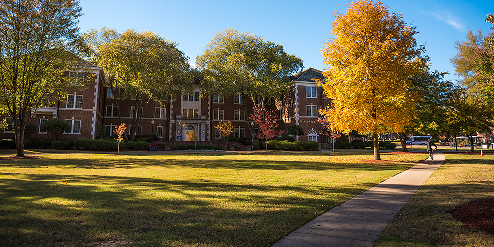 McAlister building and lawn in autumn.